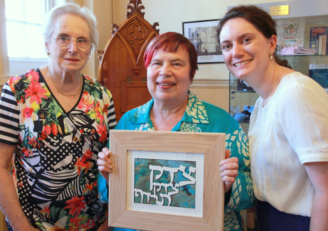 Louise Freedman and Alice Alphandary present Rabbi Janet Darley (centre) with a leaving gift