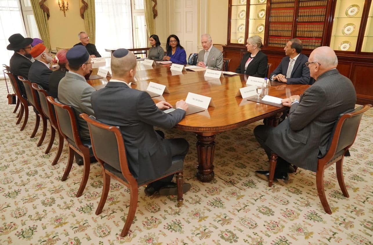 Rabbi Charley Baginsky (seated opposite King Charles III) and other faith leaders at Buckingham Palace meeting