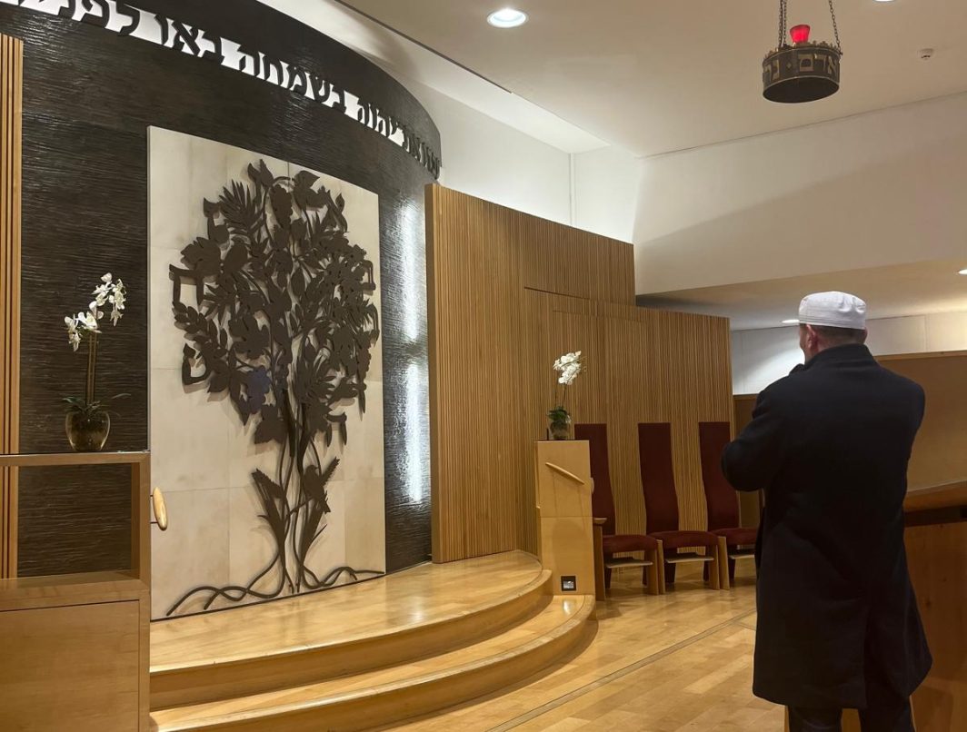 Imam Mehmed Stublla gives the call to prayer from the Alyth Bimah