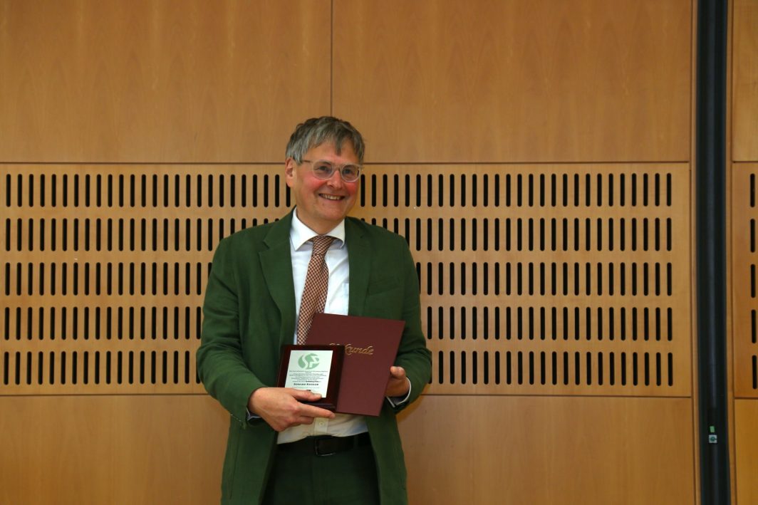 Dr Ed Kessler with his prize