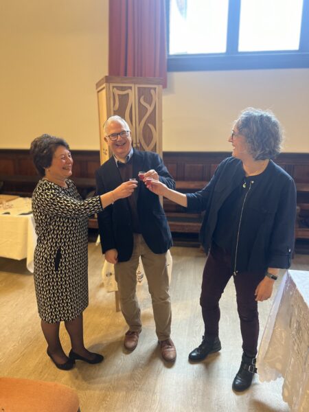 Original YLCJ members Lilian, Ben and Patricia enjoy a toast