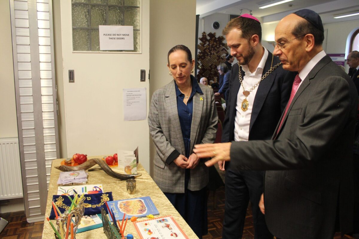 Rabbis Richard Jacobi and Charley Baginsky show the Deputy Mayor around the Exhibition