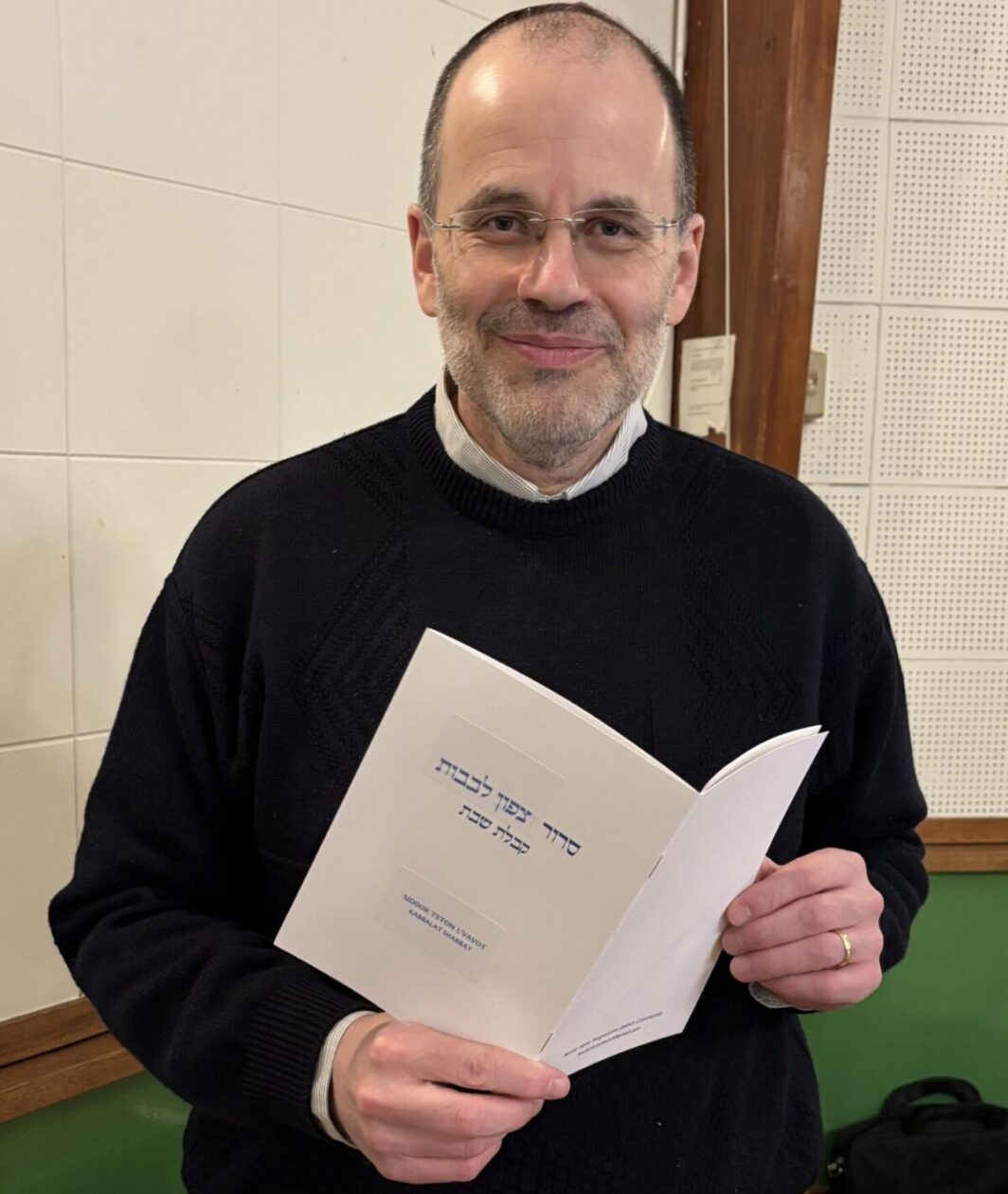 Rabbi Paul Freedman with his prayer book